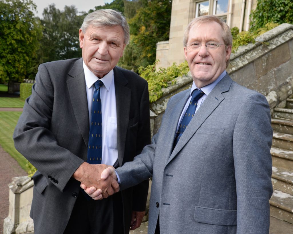 Two men shaking hands on pr deal