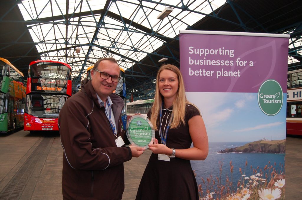 (L-R) Green Tourism CEO Jon Proctor presenting Emma Roy, Lothian Buses Environmental Officer with GOLD copy