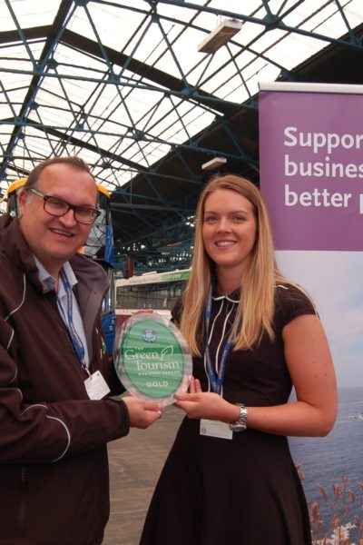 (L-R) Green Tourism CEO Jon Proctor presenting Emma Roy, Lothian Buses Environmental Officer with GOLD copy