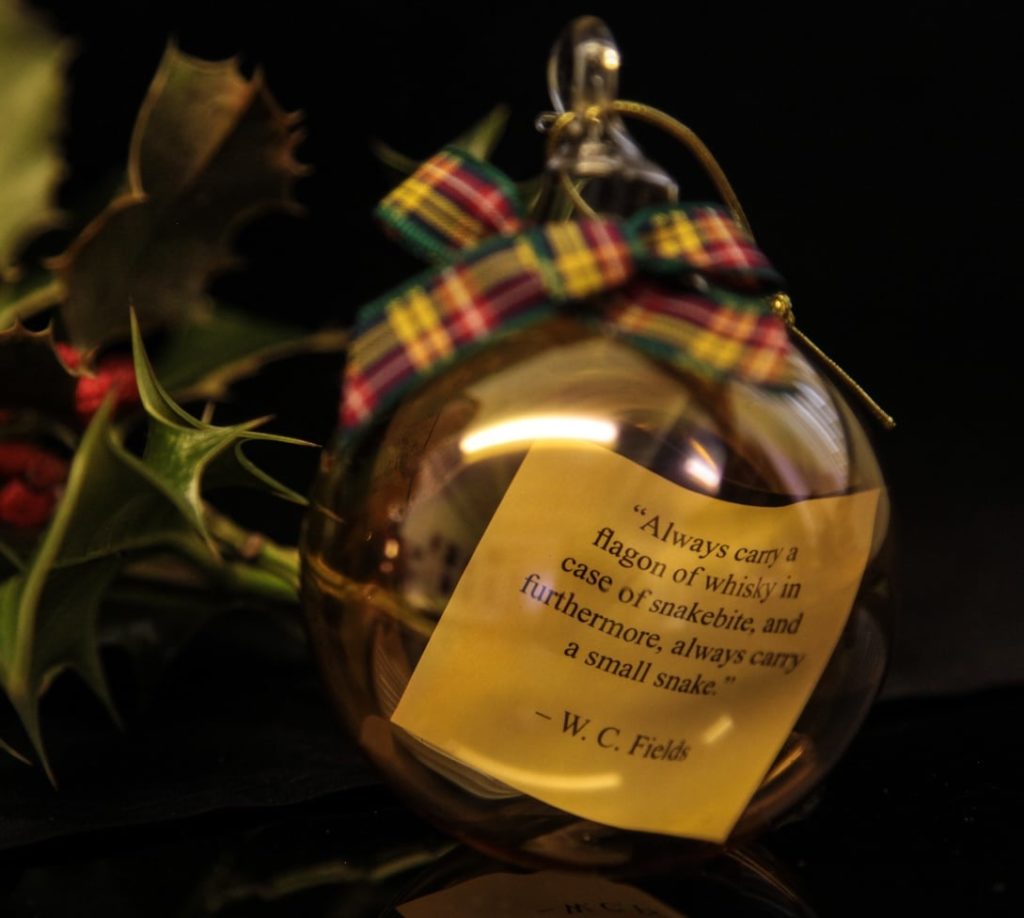 bottle of whisky with W C Fields quote